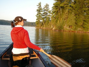 Laura Culic canoing on Kingscote Lake, Algonquin Park