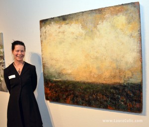 Photo of artist Laura Culic beside painting, December 5, 2013.